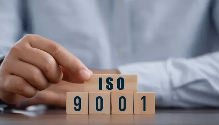 ISO 9001 internal audit process with wooden blocks spelling ISO 9001