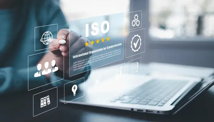 A person interacting with a virtual interface displaying "ISO" and various document control icons, representing QMS document control.