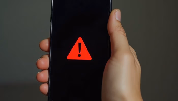 Red warning symbol on a smartphone screen, representing issues in offline commissioning software.